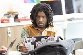 A student focuses on his assignment. Links to Gifts of Cash, Checks, and Credit Cards A student focuses on his assignment. Links to Gifts of Cash, Checks, and Credit Cards