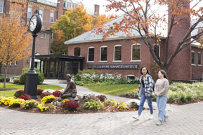 Students walk through campus together. Links to Closely Held Business Stock Students walk through campus together. Links to Closely Held Business Stock